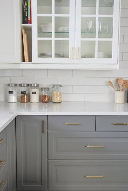 grey and white kitchen with white subway tile