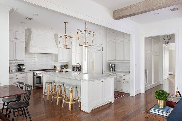 antique_white_kitchen_cabinets_with_dark_island